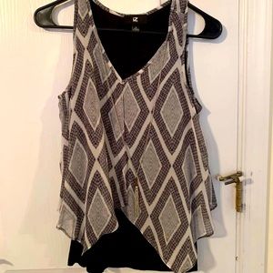 Women’s black and white blouse with necklace